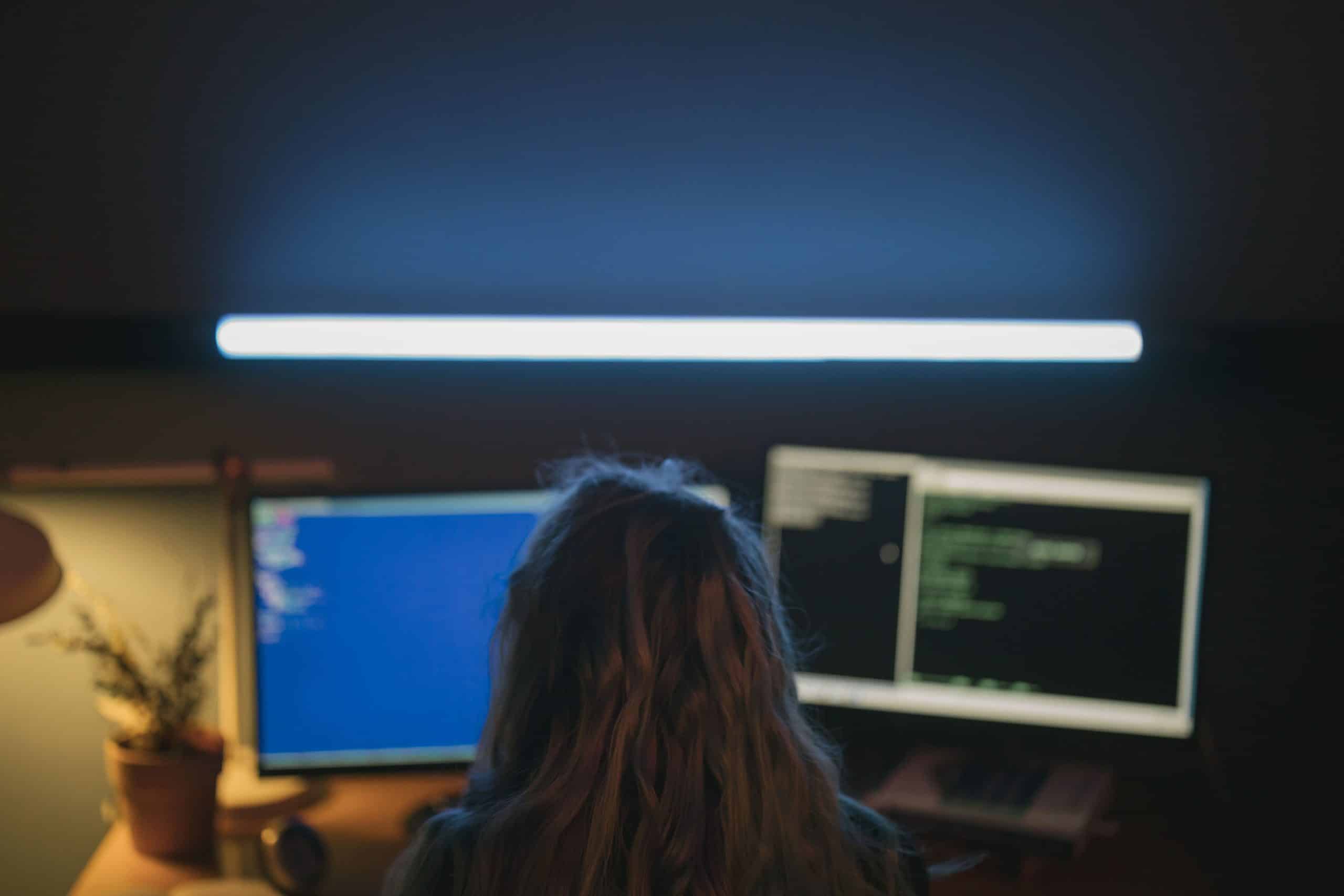 Cybersecurity professional monitoring endpoint security for business computers and devices